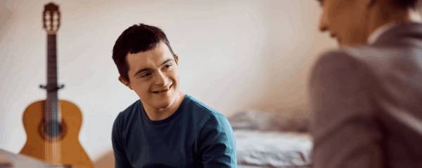 Master's-level Adaptive Skills Trainer assessing and supporting a client with developmental disabilities at Levi Life Skills